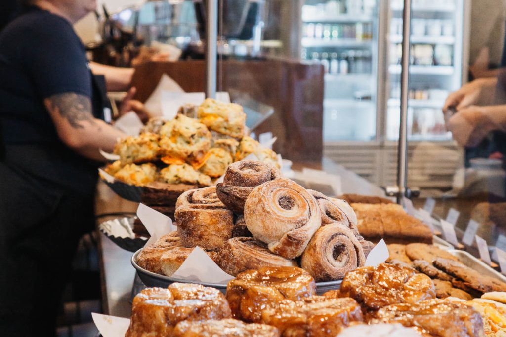 Honey & Rye Pastries Assorted Honey & Rye pastries on bakery display counter.